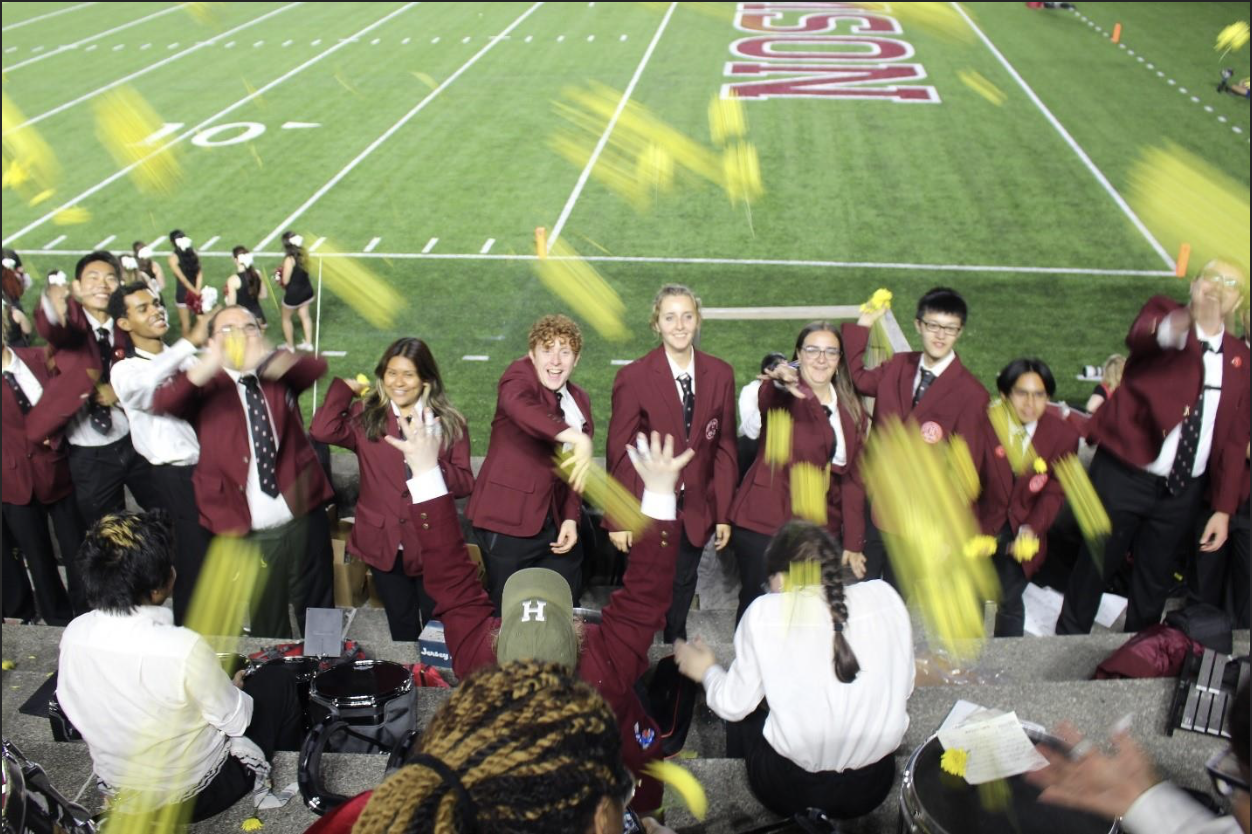 Happy bandies throwing traditional yellow flowers post game!