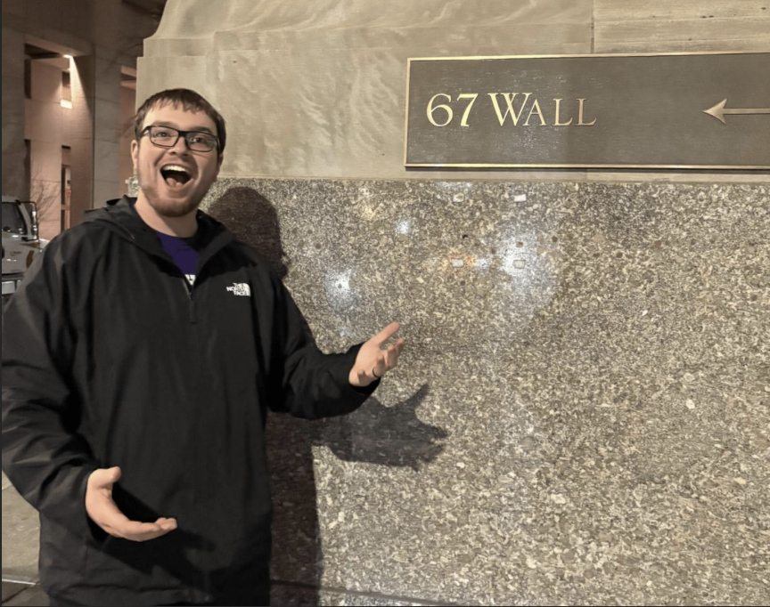 Happy bandit in front of wall that says  67 Wall!